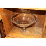 A glass pedestal bowl
