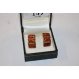 A pair of sterling silver and amber set earrings