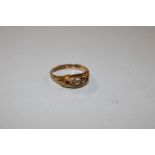 An 18ct gold ring, lacking some stones, total weig