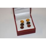 A pair of sterling silver and amber set earrings