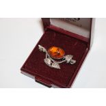 A sterling silver and amber set Art Nouveau brooch