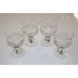 Four wine glasses with ring stems
