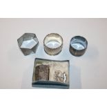 Two silver napkin rings, a silver vesta case, a si