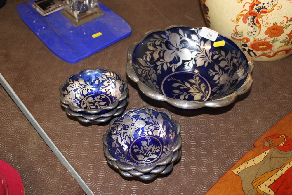 A quantity of blue glass and silver overlay bowls