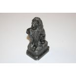 A carved stone ornament in the form of a lion