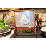 An Oriental table screen decorated with a cat and