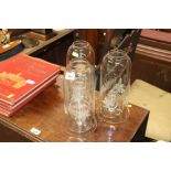 Three hurricane lamps with vine etched decoration,