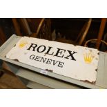 A reproduction Rolex enamel sign