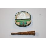 A boxed miniature lighter and cheroot holder and a