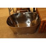 A large oval Champagne bath