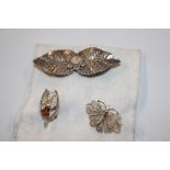 Three silver brooches