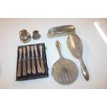 Six silver handled butter knives, a silver ink wel