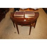 A Georgian mahogany fold over card table