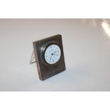 A silver cased R J Carr clock