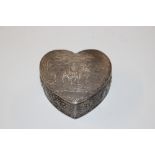 A silver heart shaped box with import marks, appro