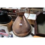 A copper four gallon measuring jug