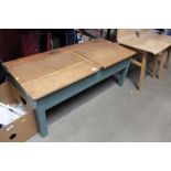 An oak twin school desk with brass mounted ink wel