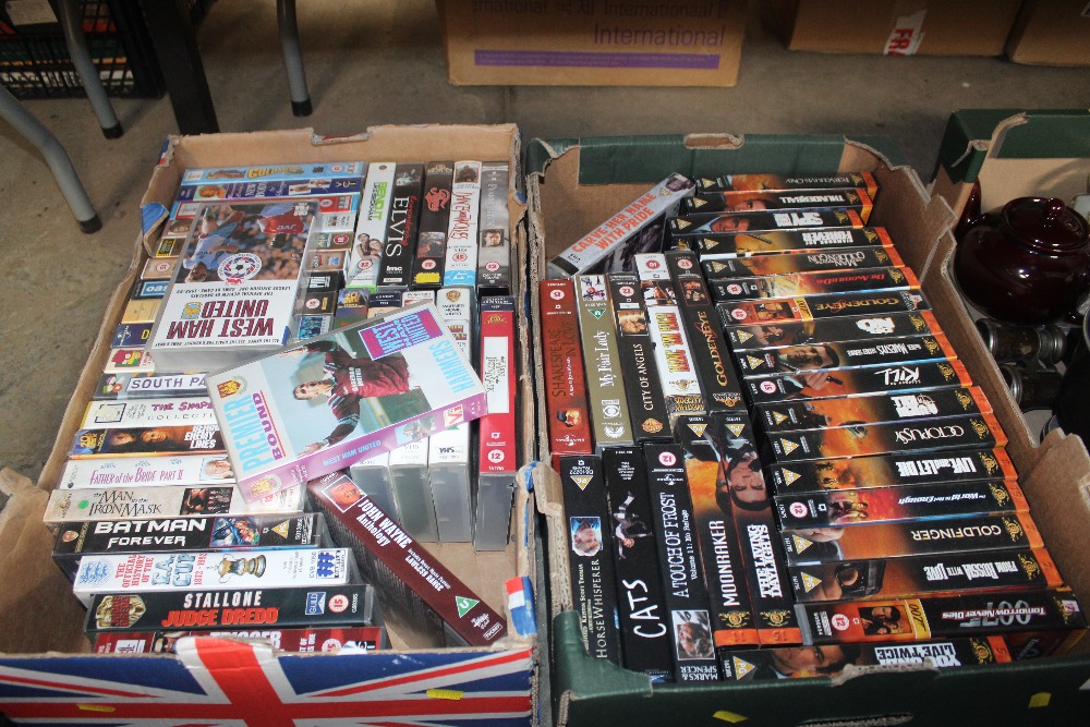 Two boxes of videos including James Bond