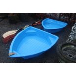 Two children's boat shaped sand pits