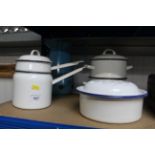 A collection of enamel ware to include steamer; ju