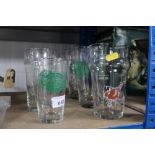 A collection of pint glasses and half pint glass