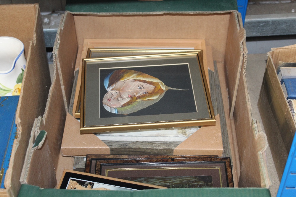 A box of various pictures and prints