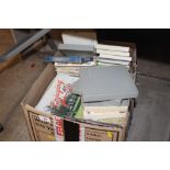 A box of miscellaneous motoring magazines, tapes e