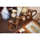 A set of four antique copper graduated measures