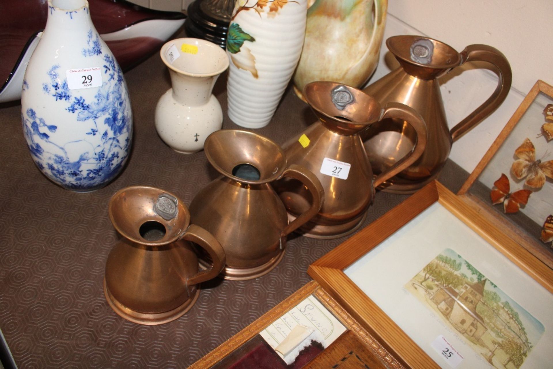 A set of four antique copper graduated measures