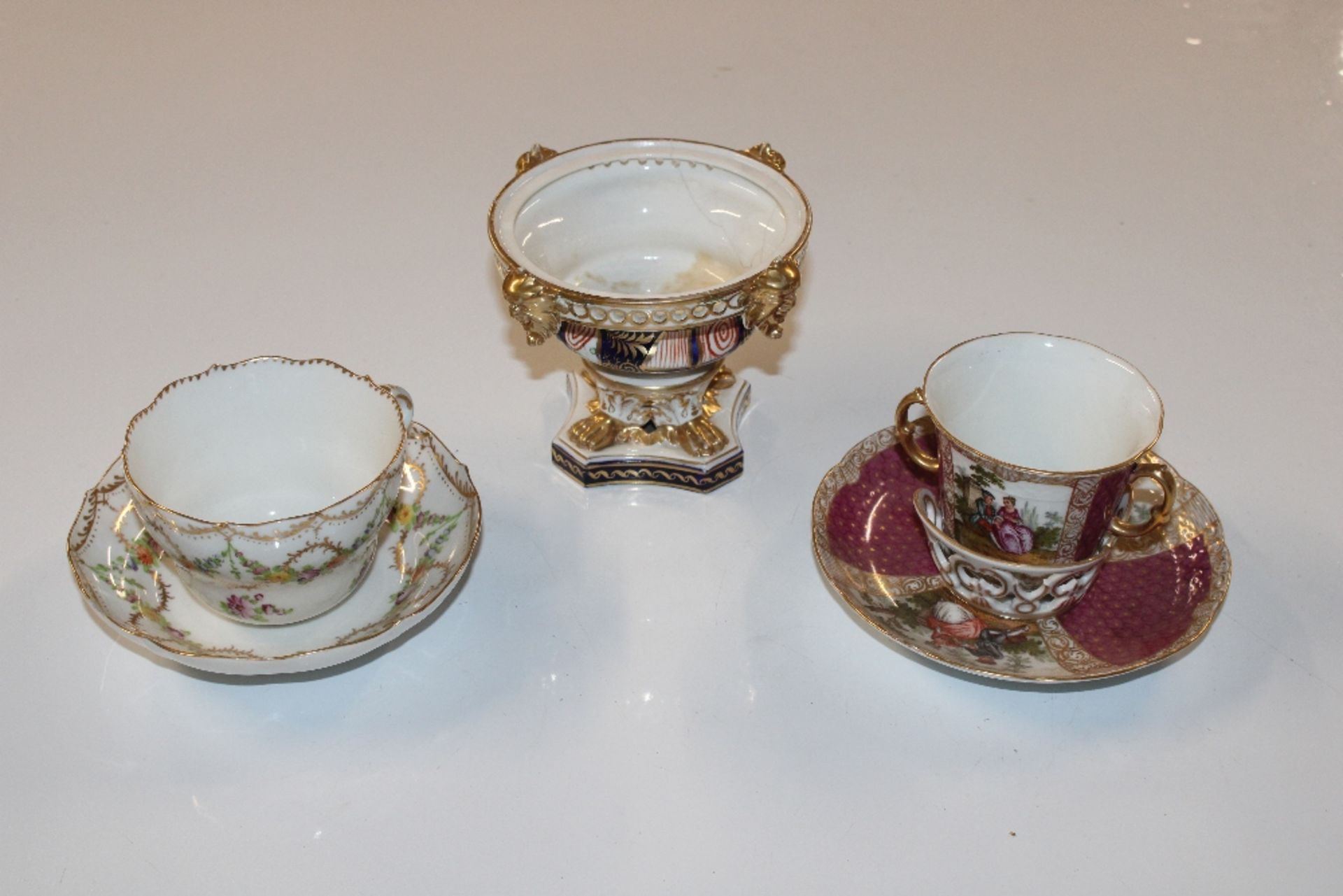 A Dresden porcelain cup and saucer; a Continental
