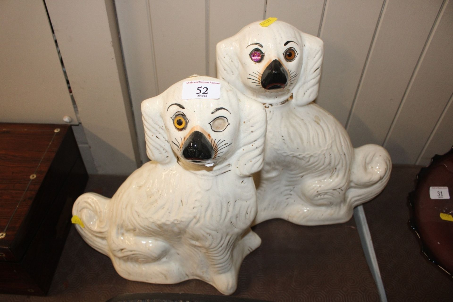 A large pair of Staffordshire spaniel ornaments (e