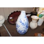 An Oriental baluster blue and white vase, characte