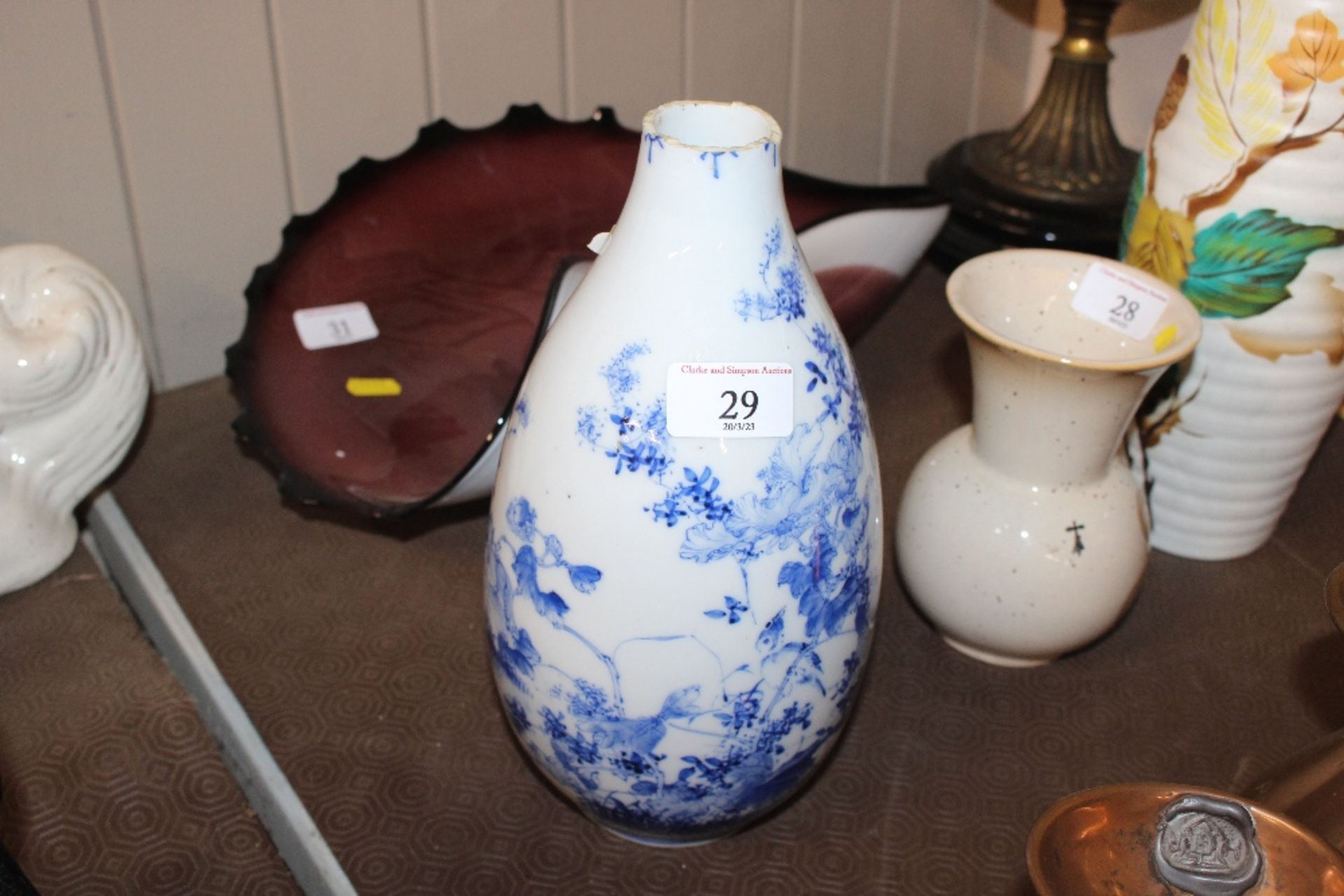 An Oriental baluster blue and white vase, characte