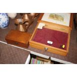 A small table top display cabinet and an inlaid wo