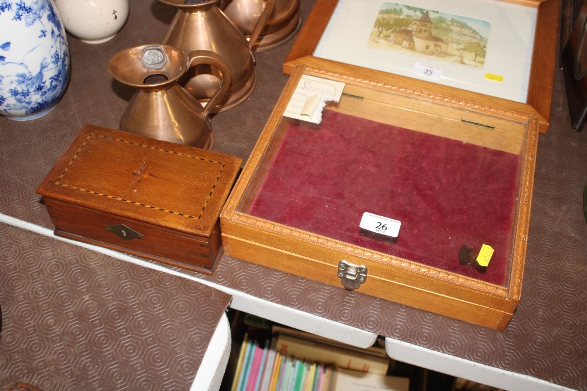 A small table top display cabinet and an inlaid wo