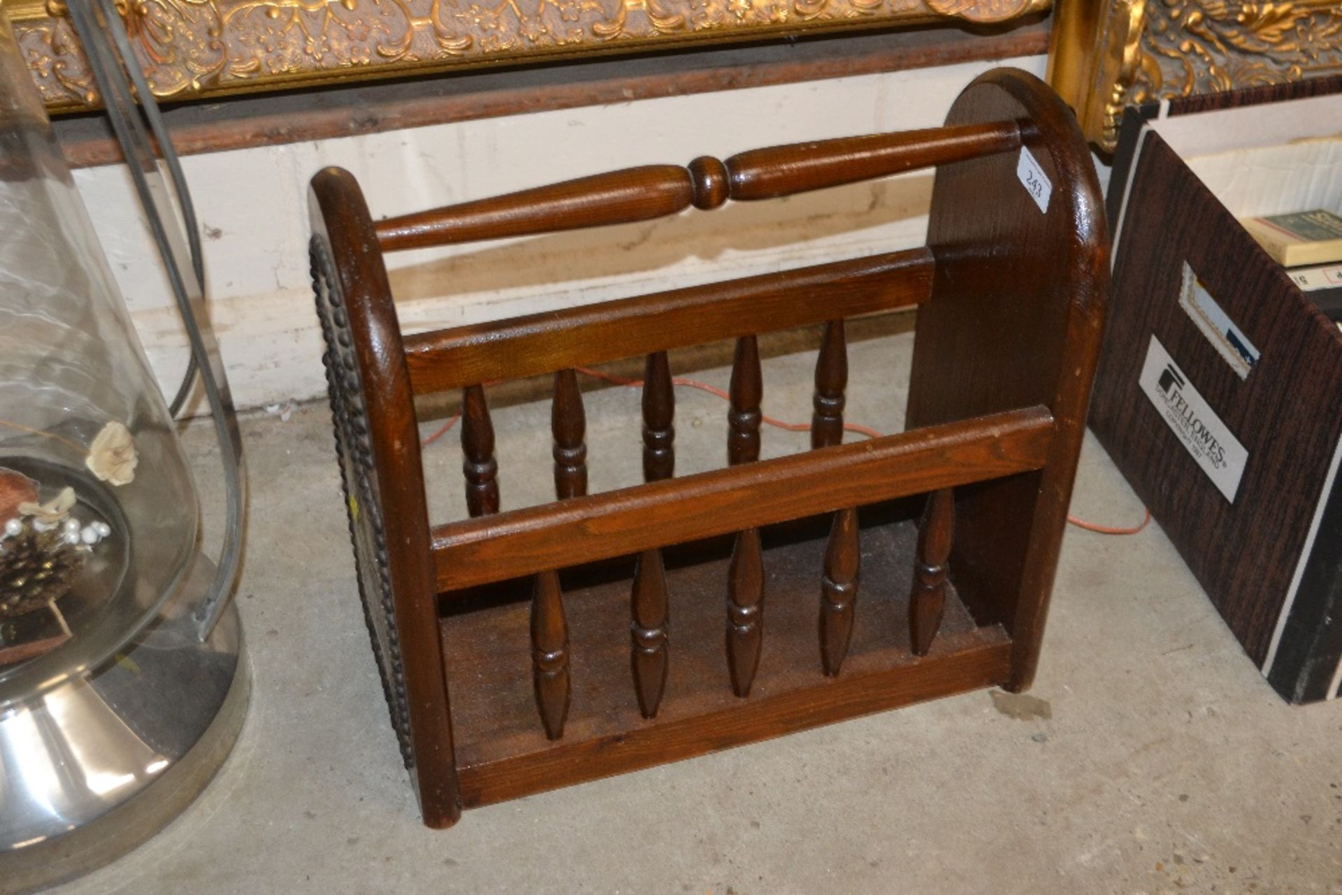A wooden and brass mounted magazine rack