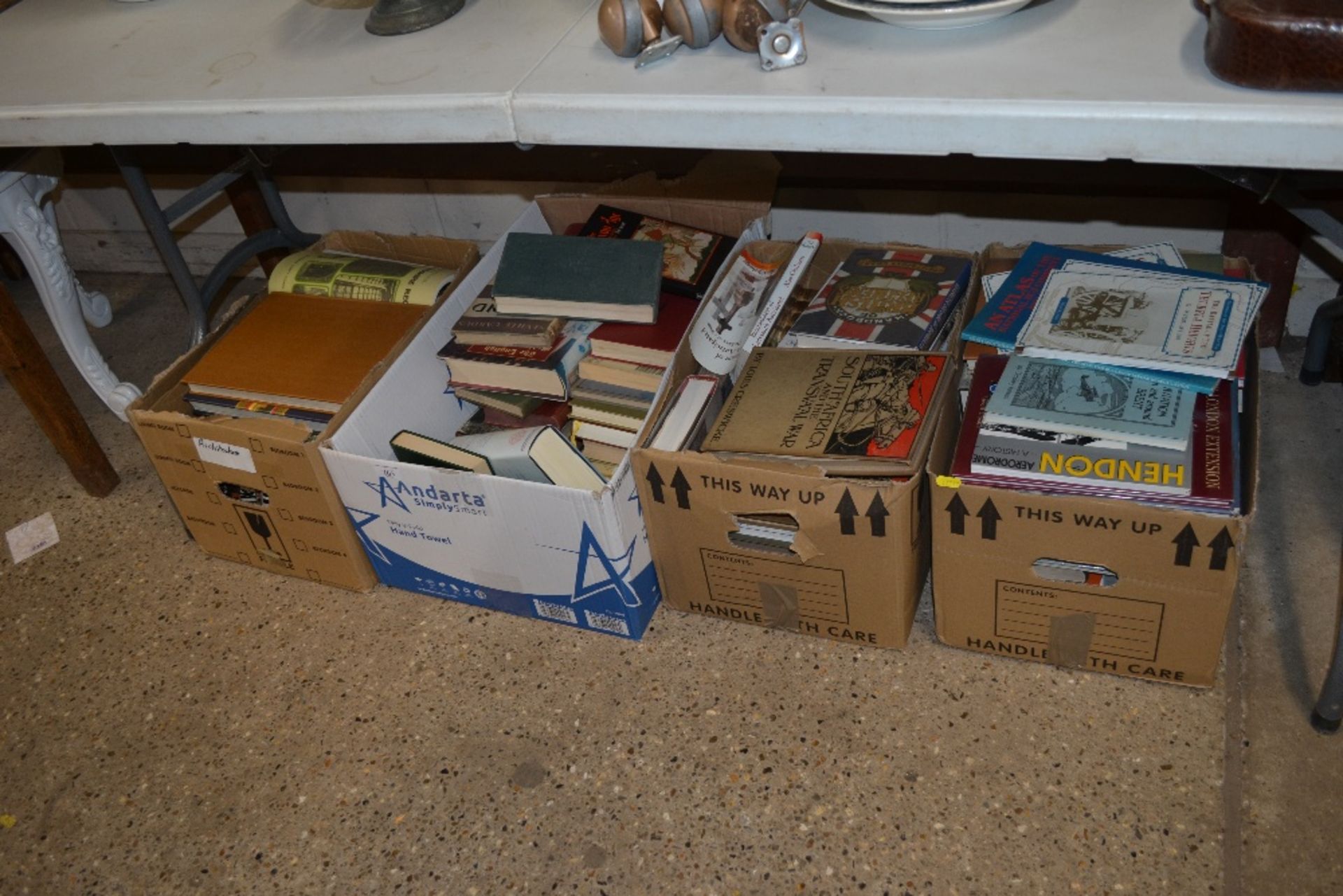 Four boxes of miscellaneous books including South