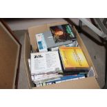 A box of miscellaneous CD's and videos