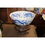 A Chinese blue and white dragon decorated bowl, ra