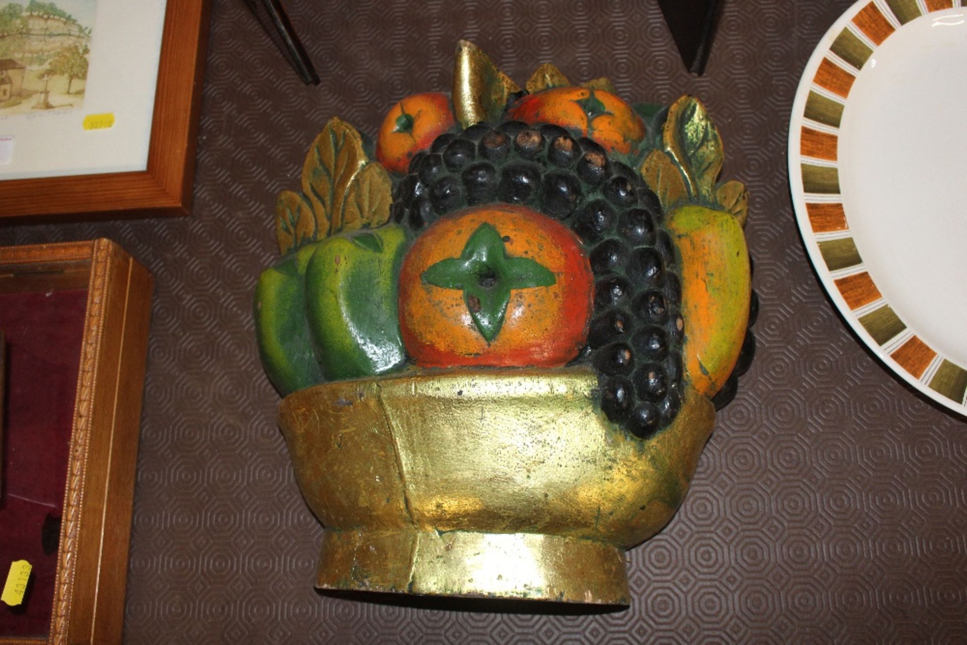 A decorative wooden fruit carving
