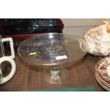 An antique glass cake stand