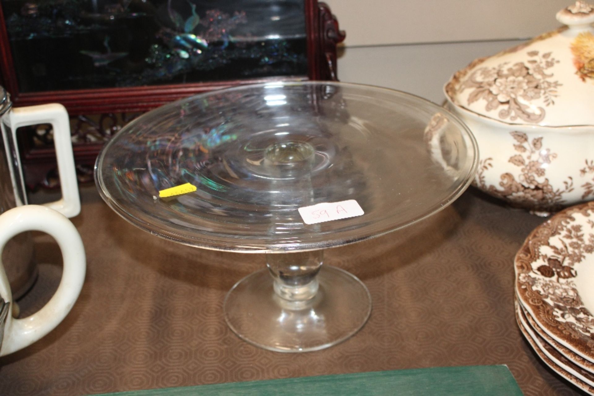 An antique glass cake stand