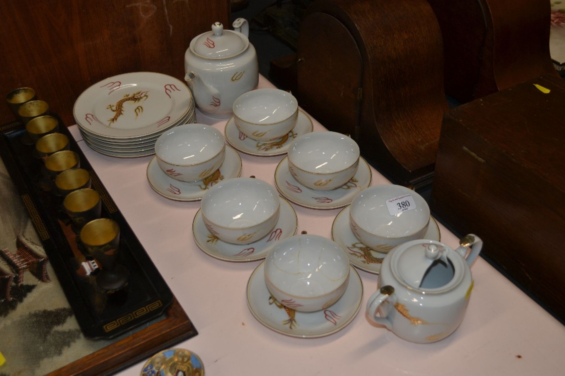 A Japanese dragon decorated part tea set with lady