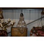 A glass and metal ware baluster shaped hanging cei