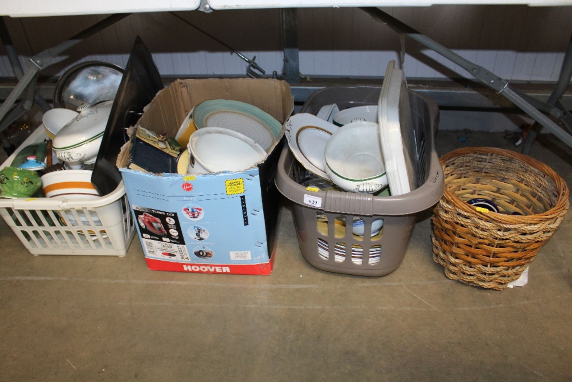 Three boxes and a wicker basket containing various
