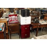 A filing cabinet and a two table top paper chests