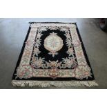 An approx. 6'8" x 4'2" Chinese wool floral pattern