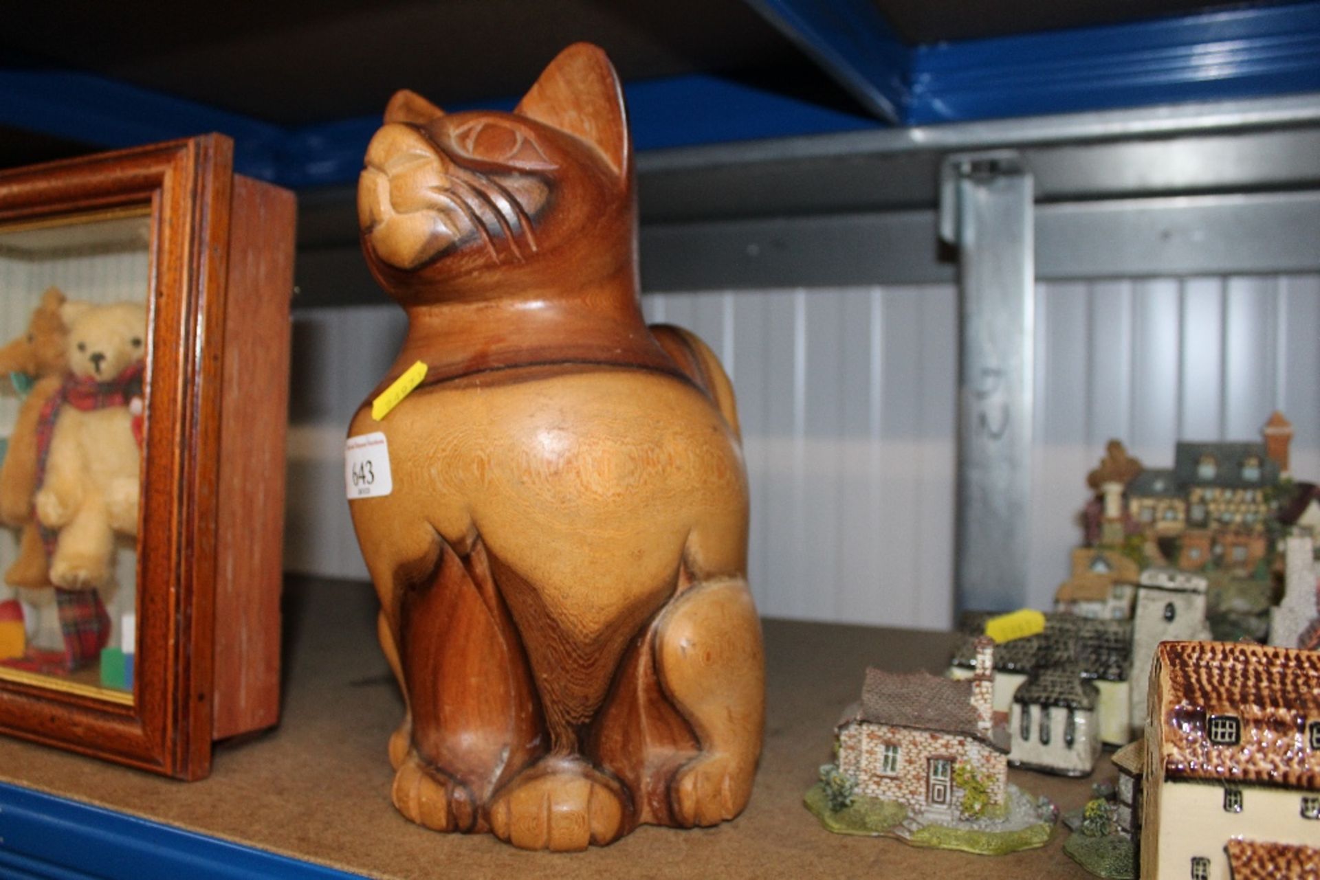 A carved wooden cat