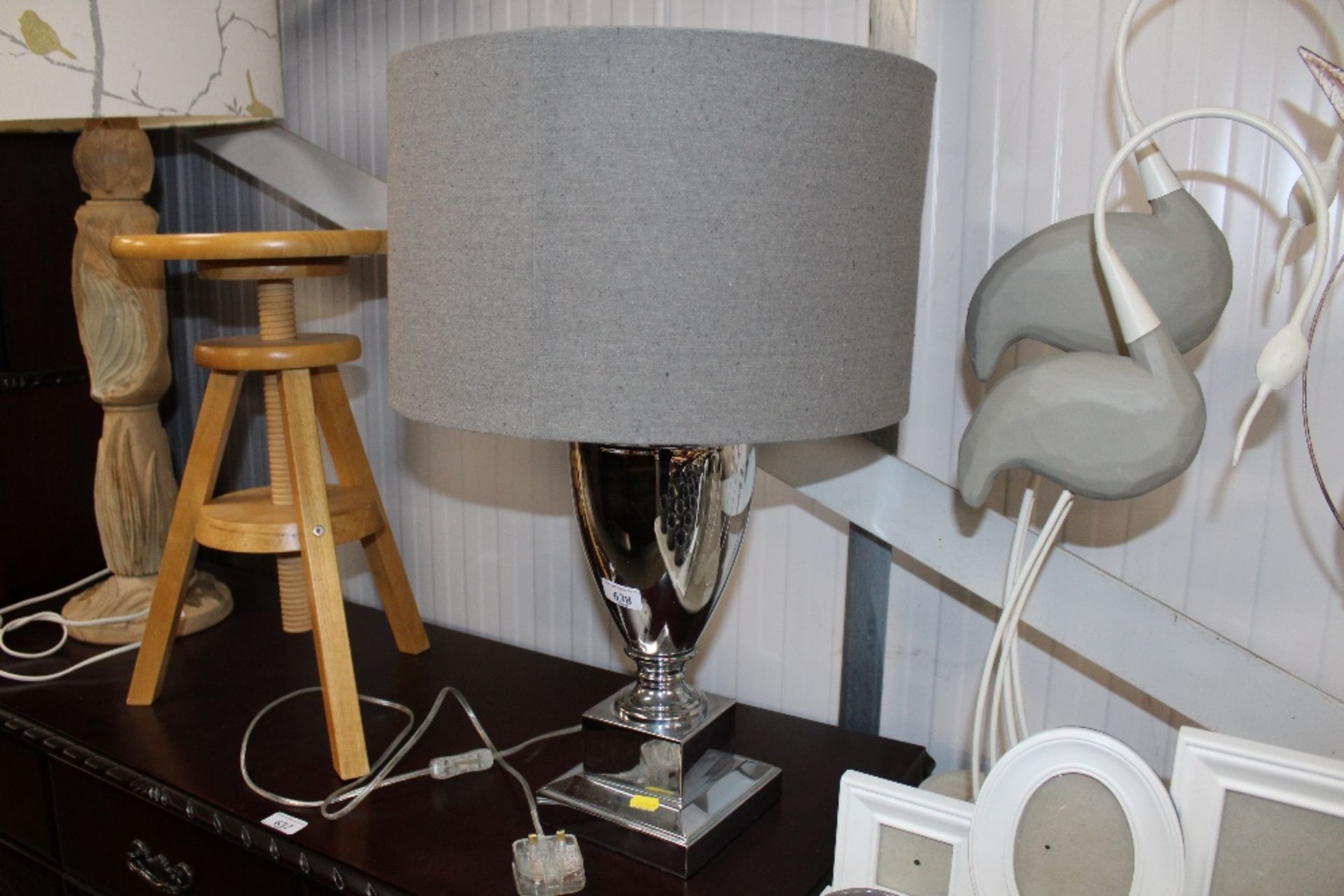 A modern table lamp with grey shade