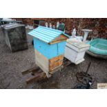 Two wooden bee hives